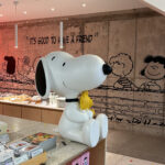 Snoopy Place Busan main interior featuring a cute Snoopy figurine and bakery shelf