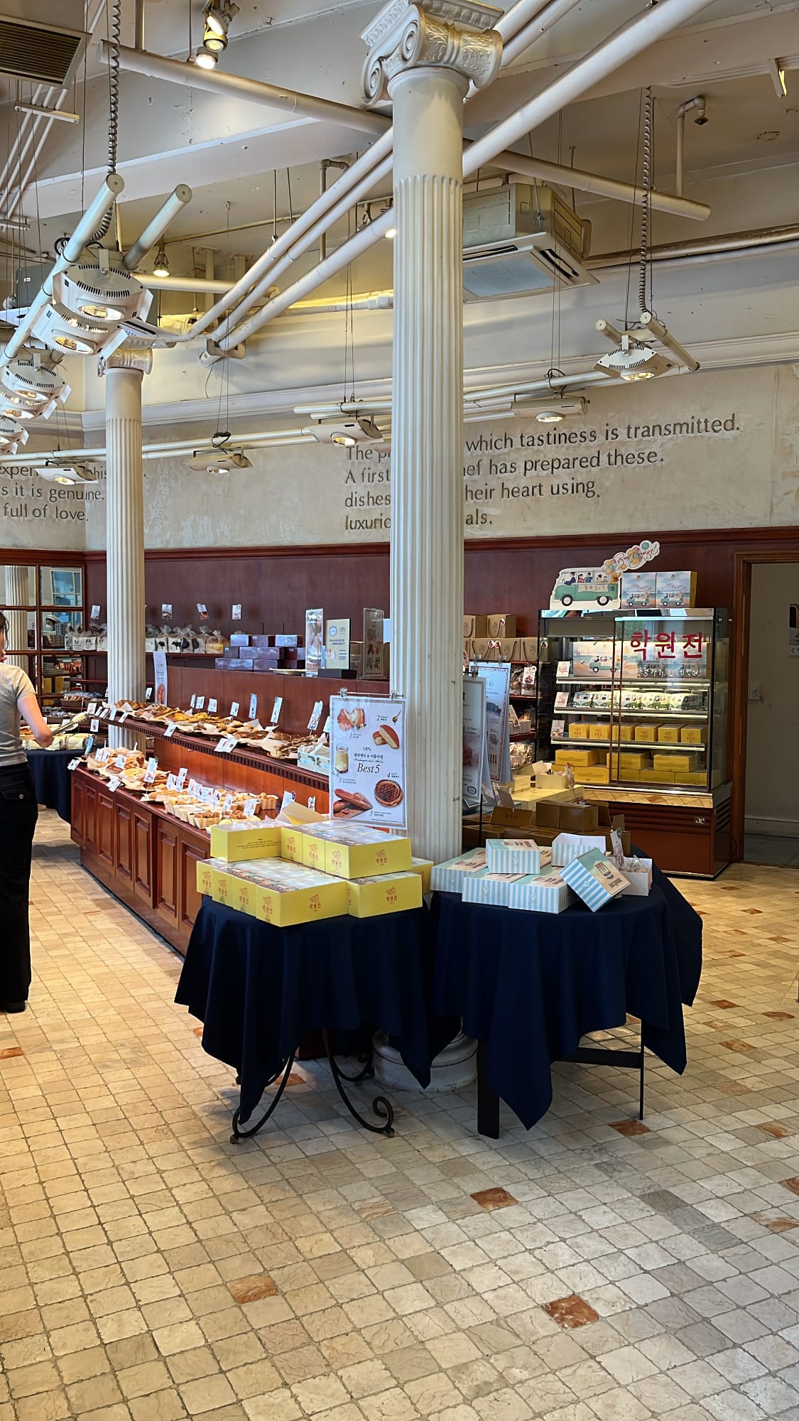 Spacious interior and classic pillar bread display at OPS Bakery Busan