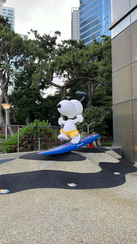 Life-size Surfing Snoopy statue outside Snoopy Place Busan in Haeundae