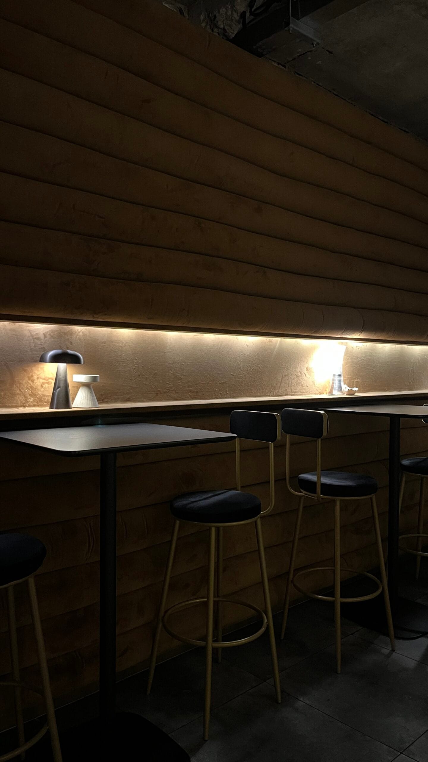 Cozy ambient lighting and bar seating at Busan cocktail bar Corduroy Fellaz