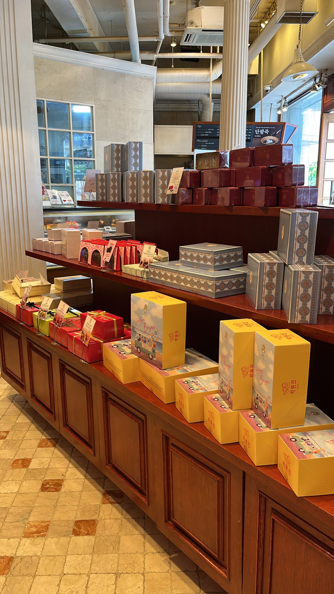Signature Hakwonjeon sponge cake gift boxes at OPS Bakery Busan