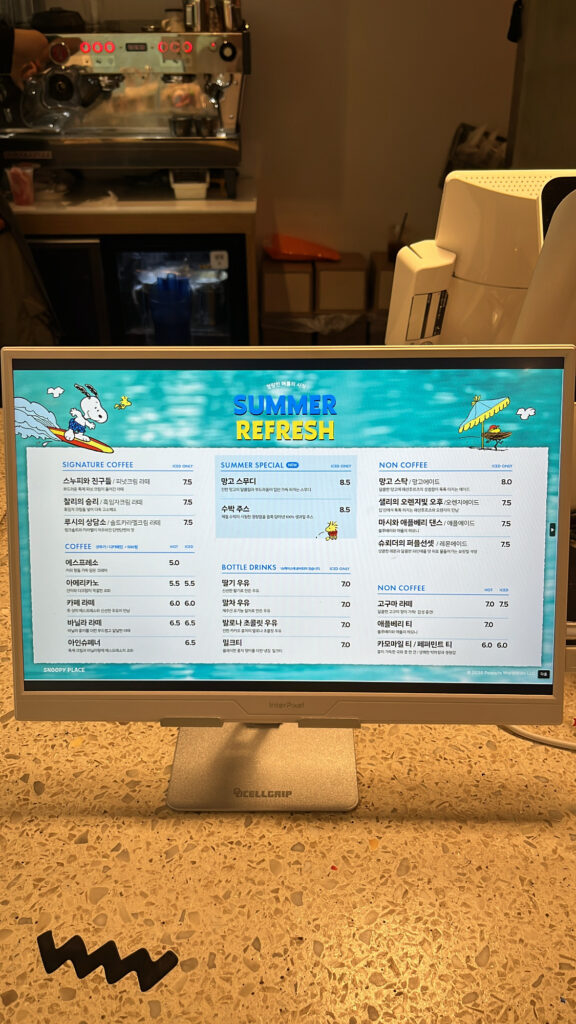Drink menu screen at Snoopy Place Busan cafe in Haeundae