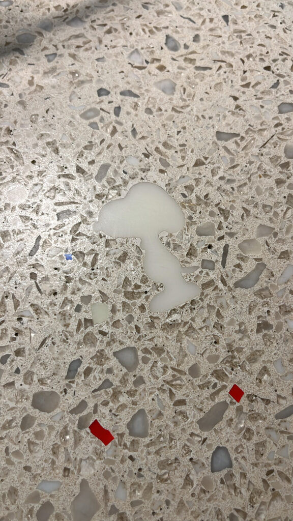 Cute Snoopy character graphic detail on the floor tile at Snoopy Place Busan