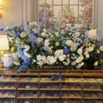 The luxurious European-style floral display table and dessert showcase at OPS Bakery Busan Camellia Branch.