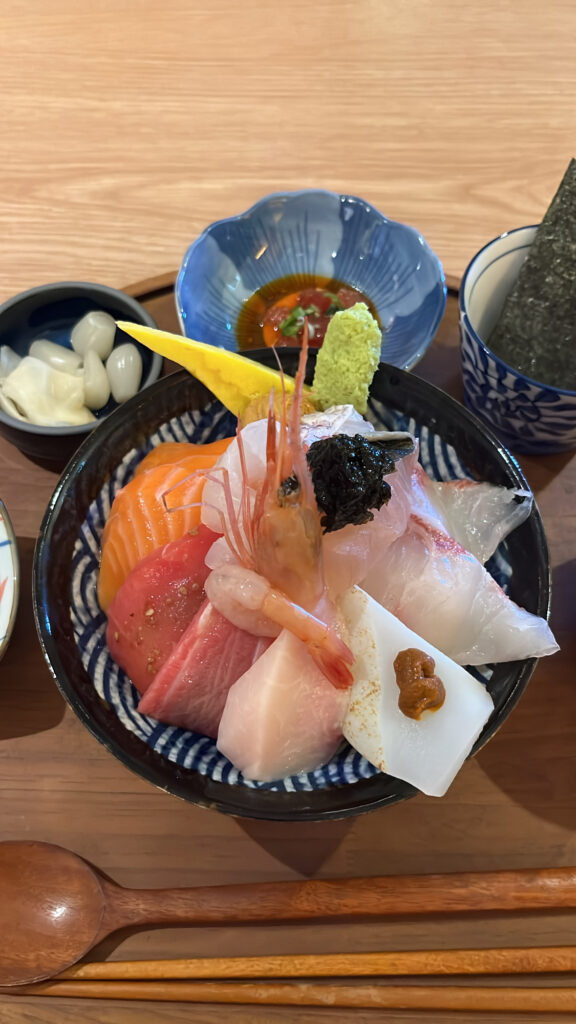 Generous thick cut sashimi bowl representing best seafood in Gwangalli