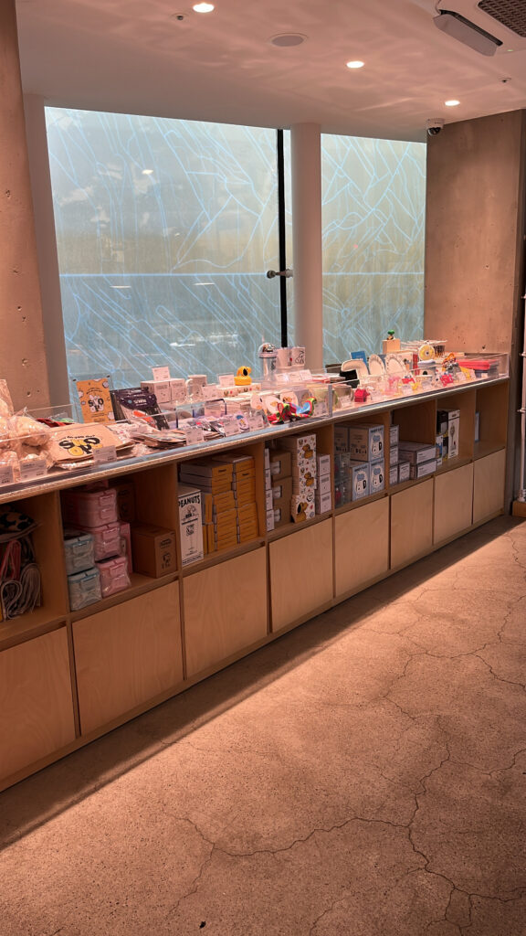 Cute Snoopy keyrings and coffee mugs available as souvenirs at Haeundae cafe