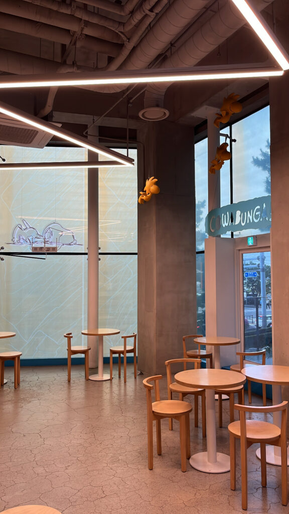 Spacious and modern seating area inside Snoopy Place Busan cafe