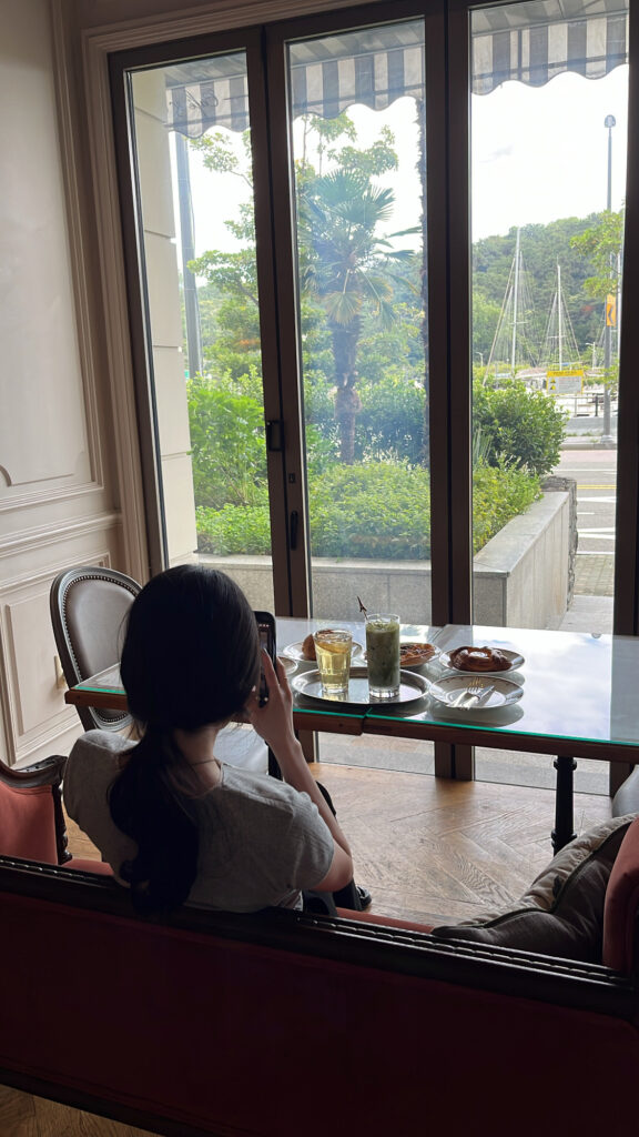 De Marigny Busan window seating view with marina and yachts