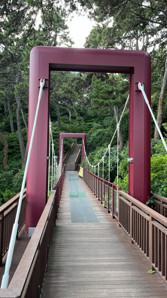 Crossing the red suspension bridge at Dongbaekseom Island