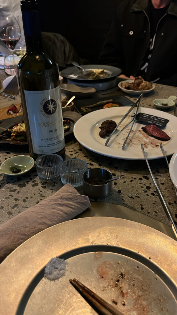 Sassicaia Super Tuscan red wine bottle on the dining table at Moment Local Busan