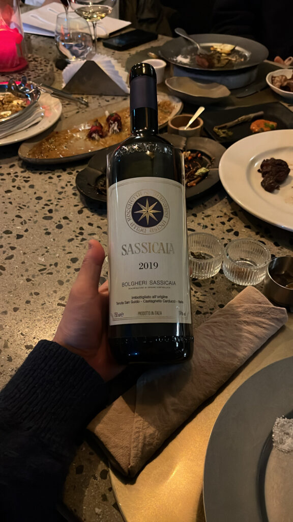 Close-up of a 2019 Sassicaia Super Tuscan wine bottle at Moment Local Busan