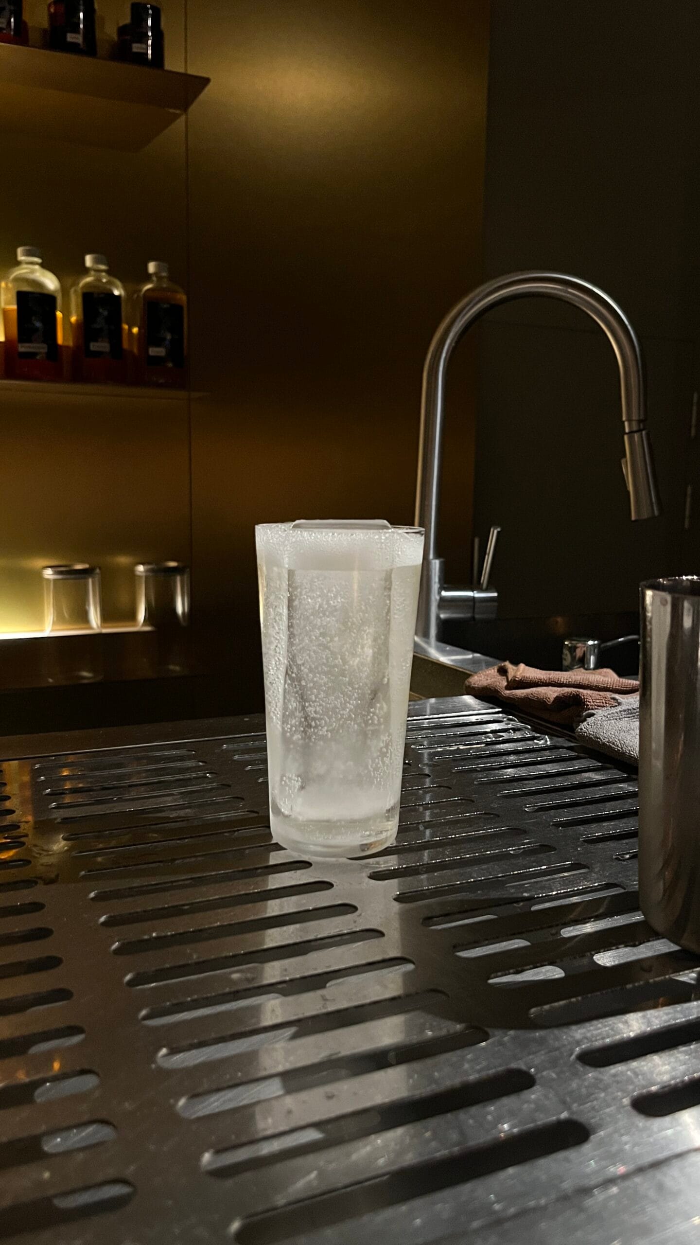 Refreshing sparkling clear highball cocktail with long cube ice