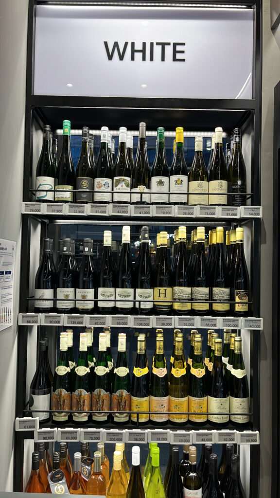 white wine bottles on display shelves