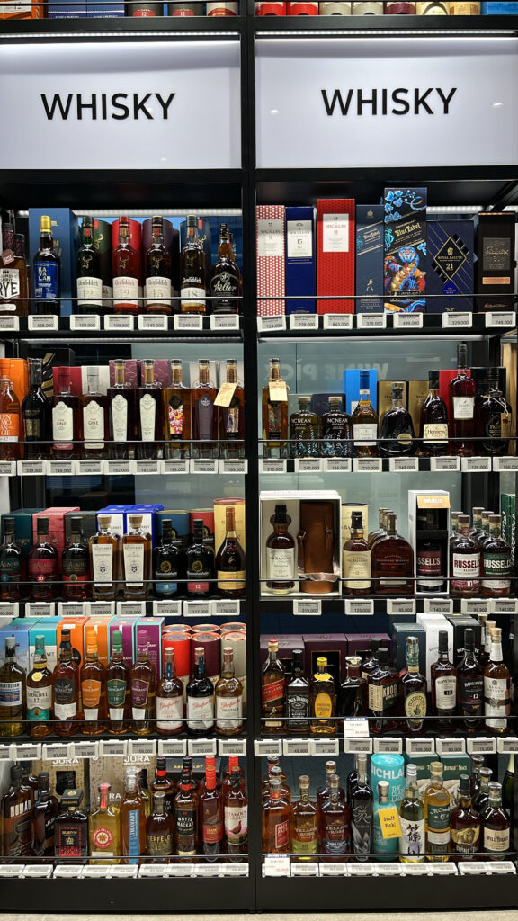 Whisky display shelves featuring major brands at WINE PICKS
