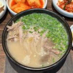 EomYongBaek Doejigukbap Haeundae main pork soup bowl with fresh chives