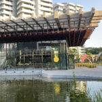 Exterior view of Sobae Busan with its reflective water pond and modern architecture in Gijang