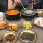 Wandduk Sundubu Centum City table setting with soft tofu stew and side dishes