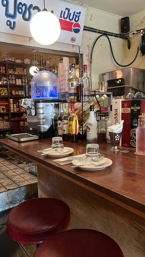 Cozy bar counter and authentic Thai street-style interior at Pili Pili Busan