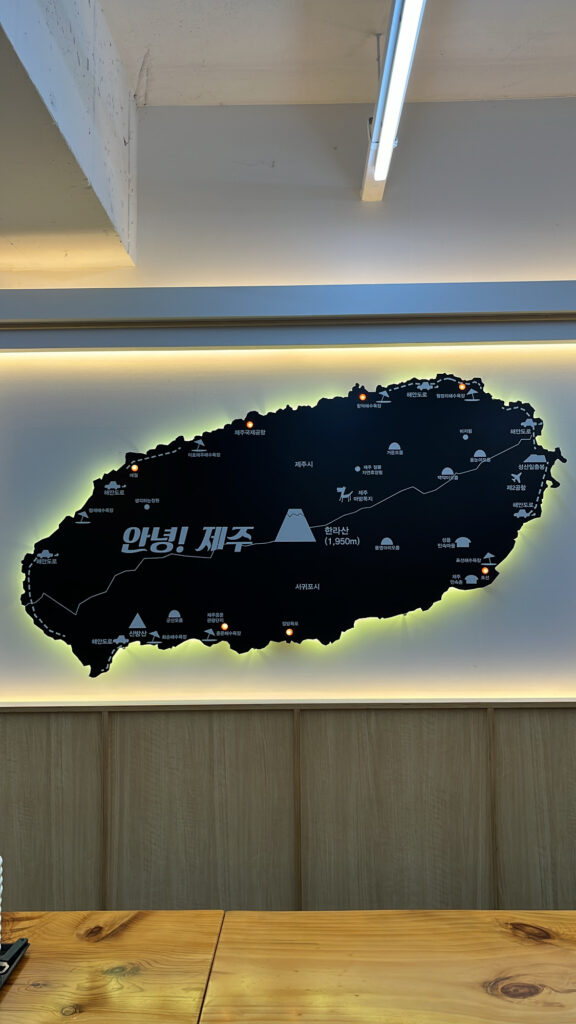 Wall sign explaining Jeju style beef soup chain origins at Jeju Eunhuine Haejangguk
