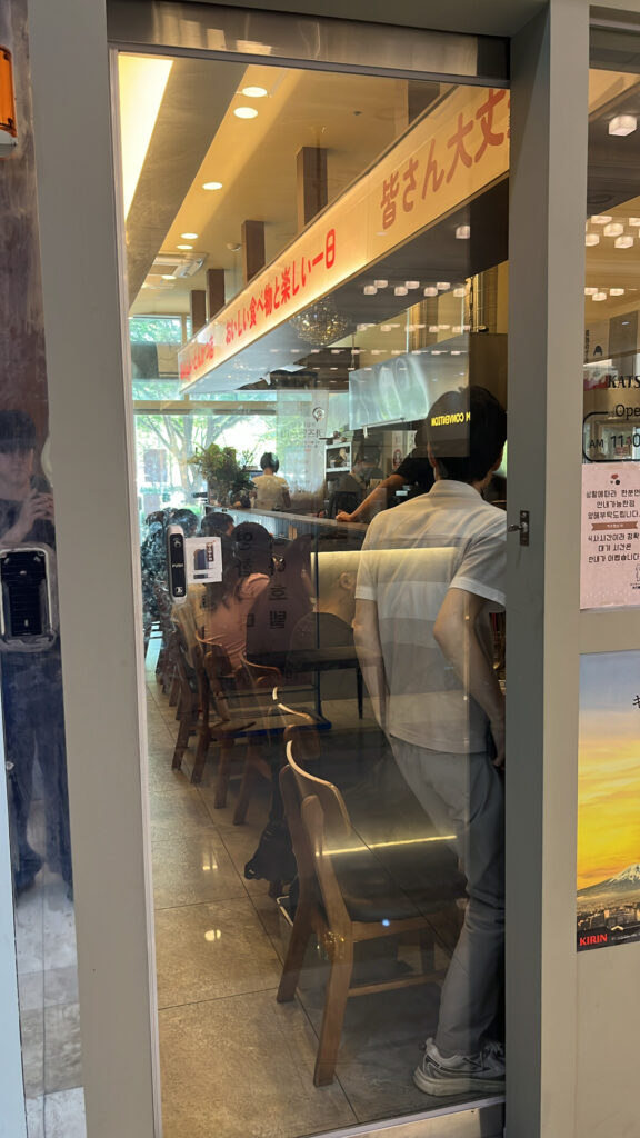 Busy indoor atmosphere at Katsu Mansion 10 Busan restaurant