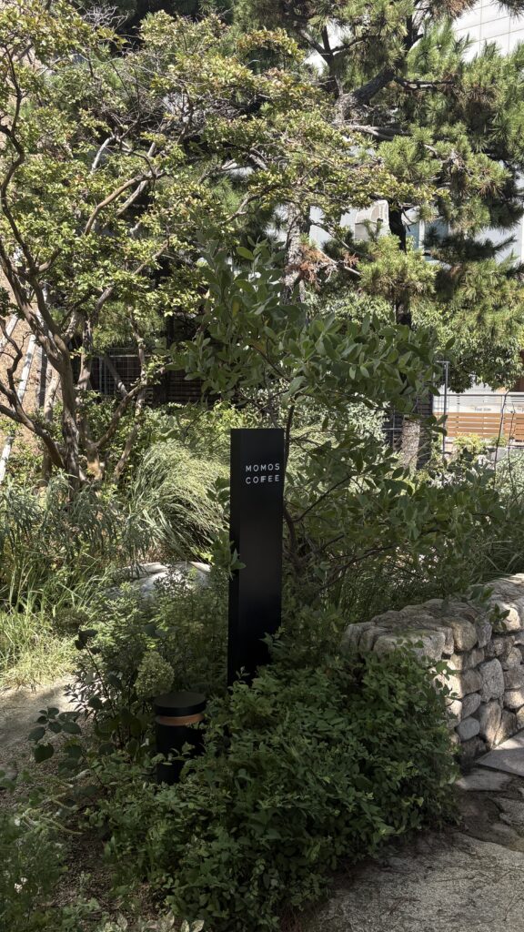 Hidden garden trail within the residential complex leading to Momos Coffee Marine City