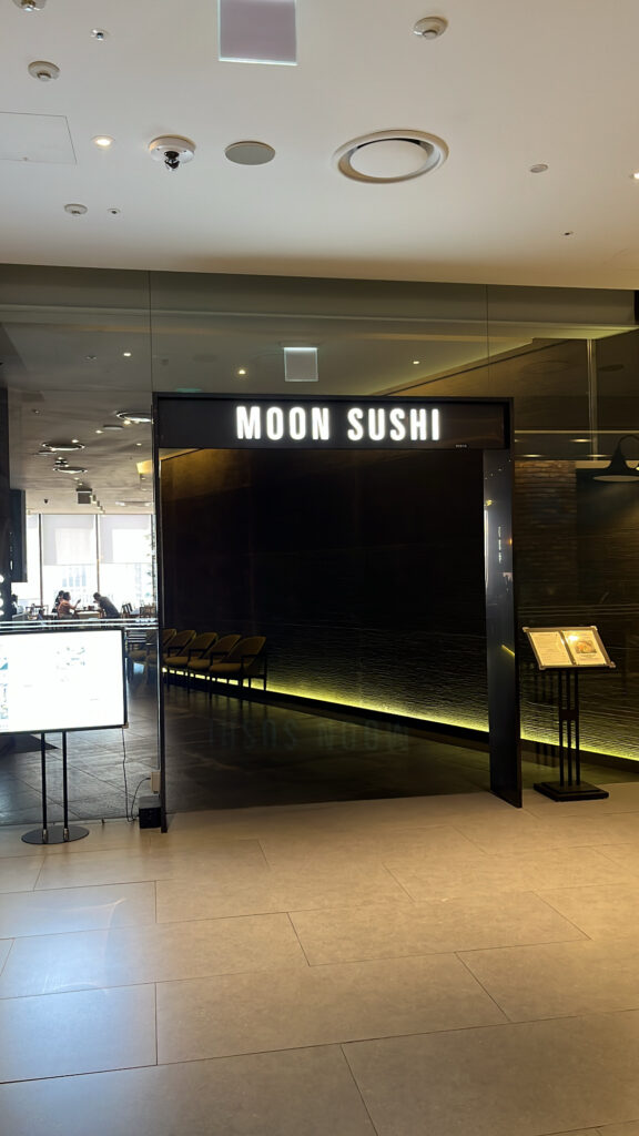 Front entrance of Moon Sushi located right by the escalator