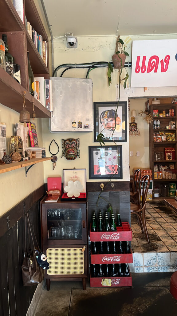Retro Thai ornaments and colorful shelf decorations inside Pili Pili Busan