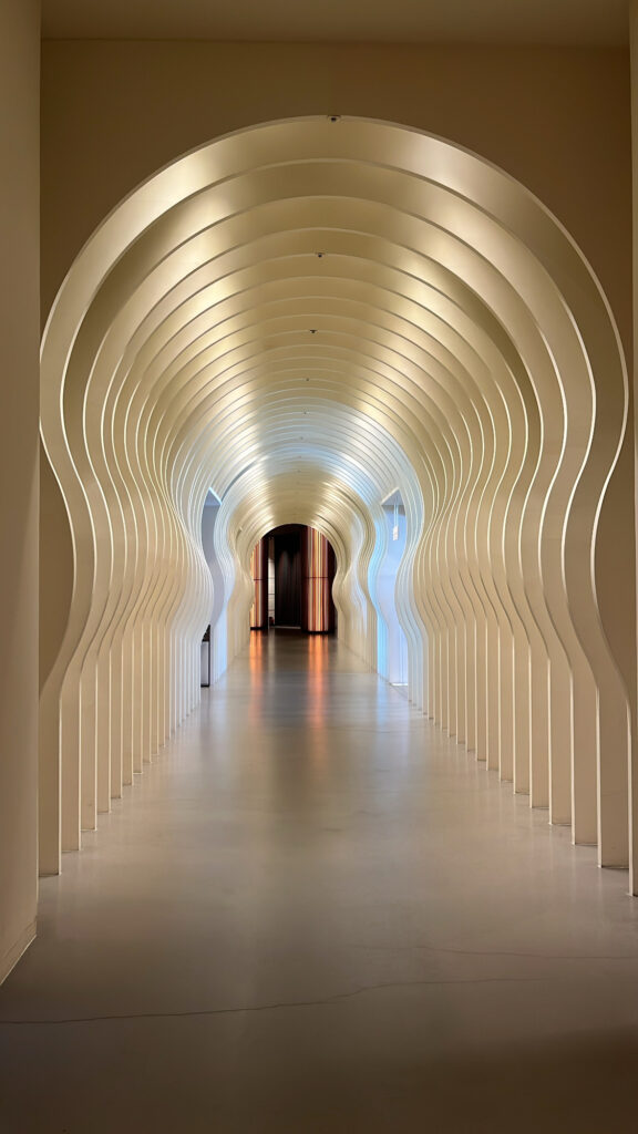 Iconic curved tunnel photo zone on the 1st floor of Ananti at Busan Cove