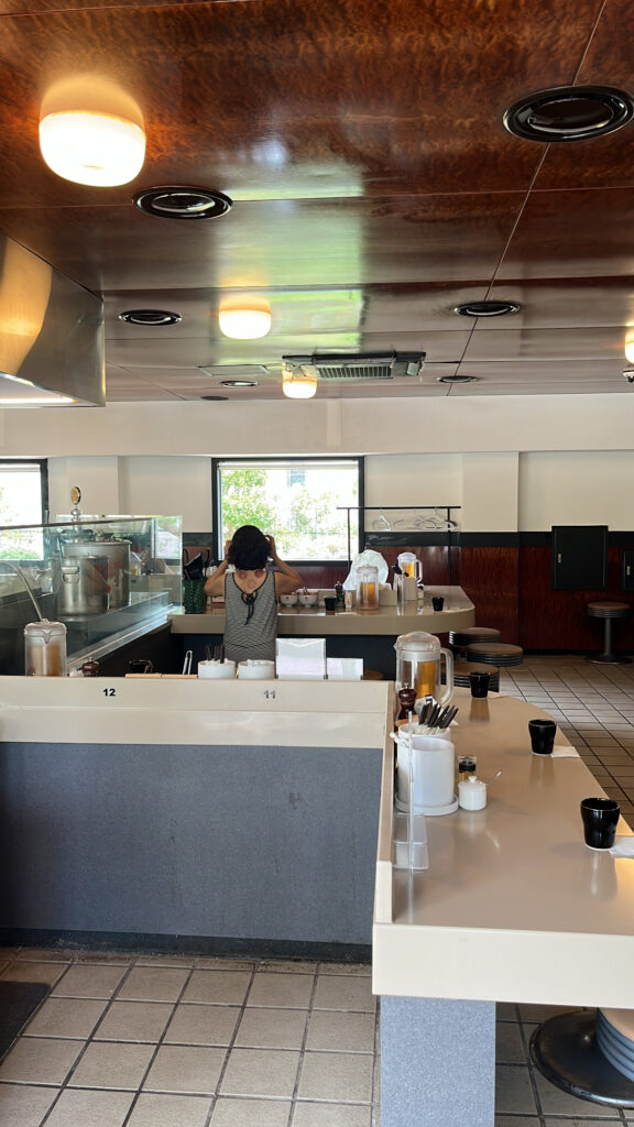 Spacious bar counter accommodating around 30 guests at Matsudo Busan