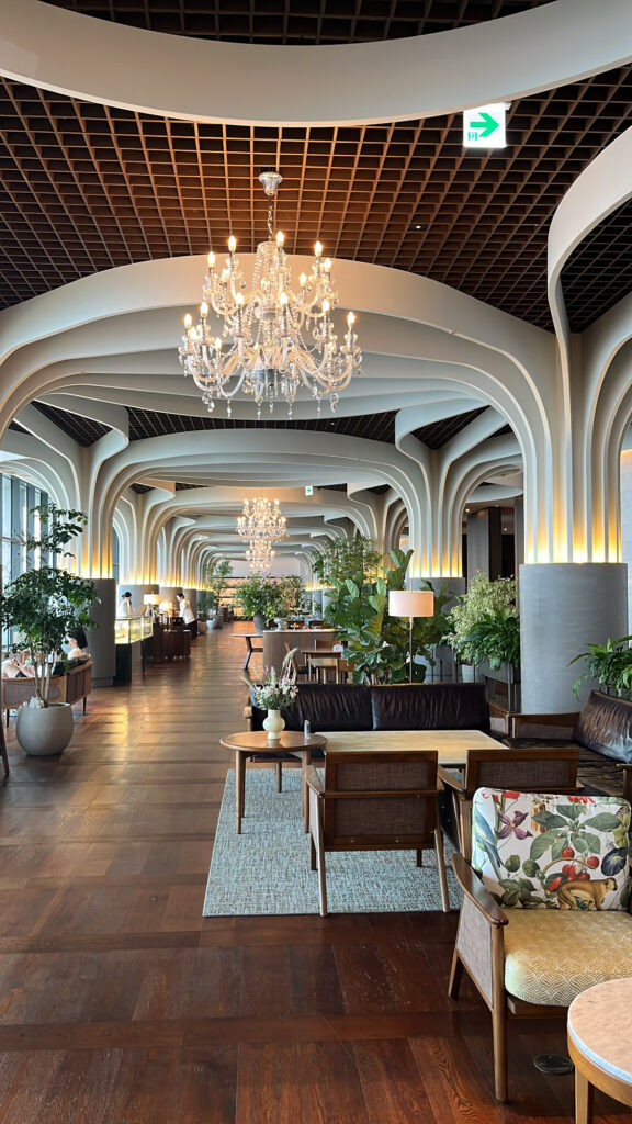 Spacious weekday seating and grand chandelier at McQueen's Lounge Busan