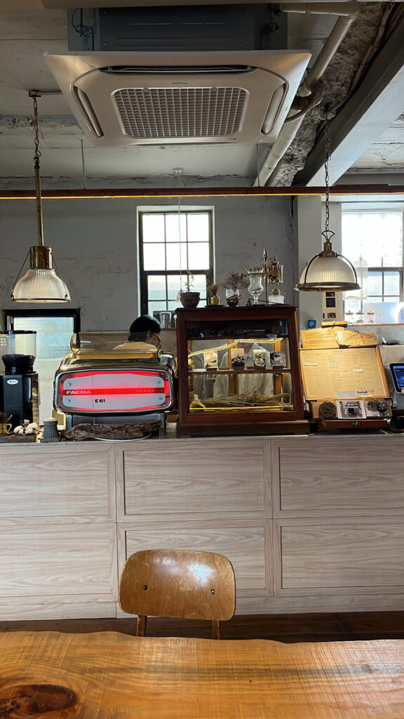 Cozy antique counter area and vintage wooden interior decoration inside Green Nomad Busan