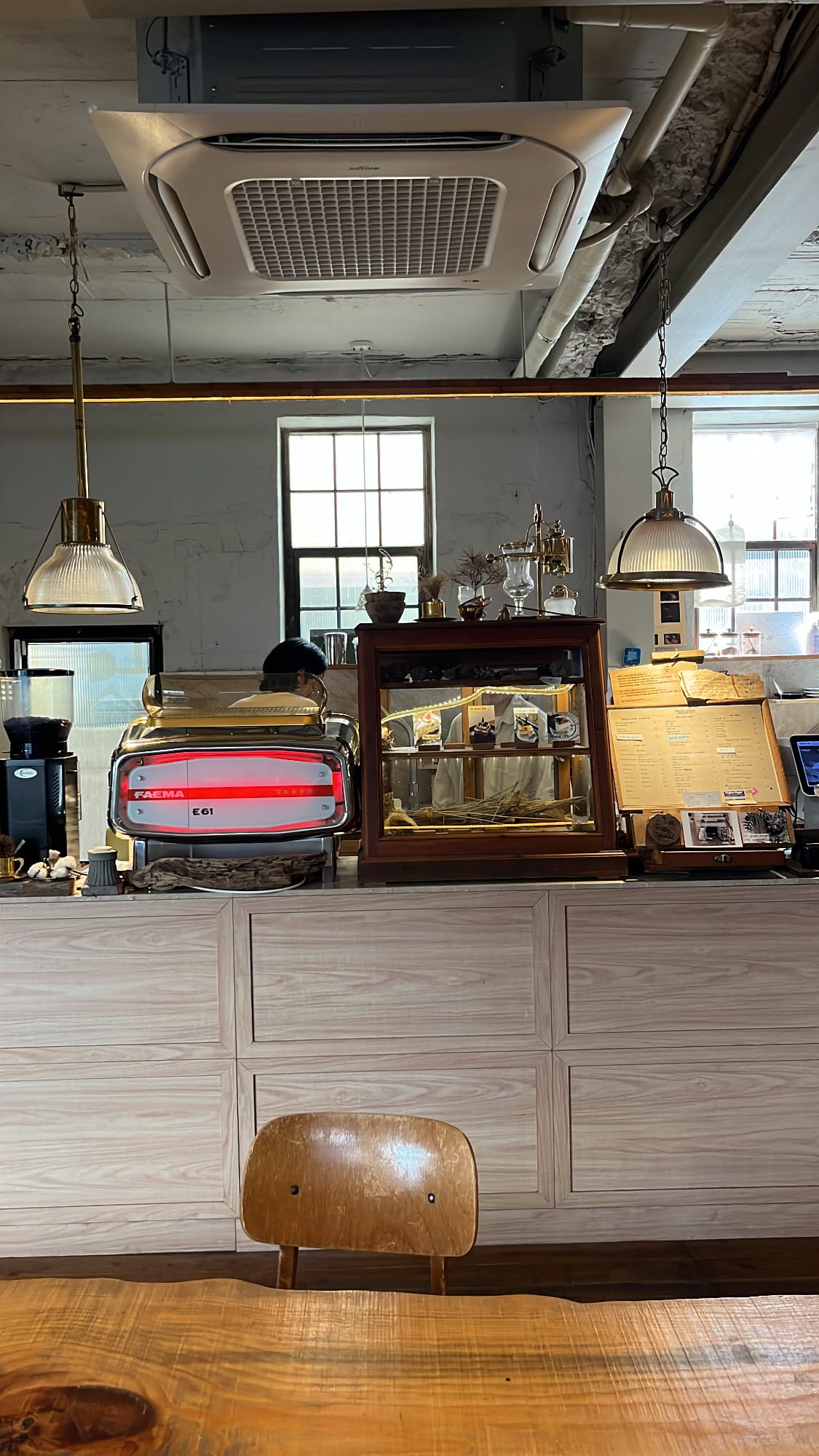 Cozy antique counter area and vintage wooden interior decoration inside Green Nomad Busan
