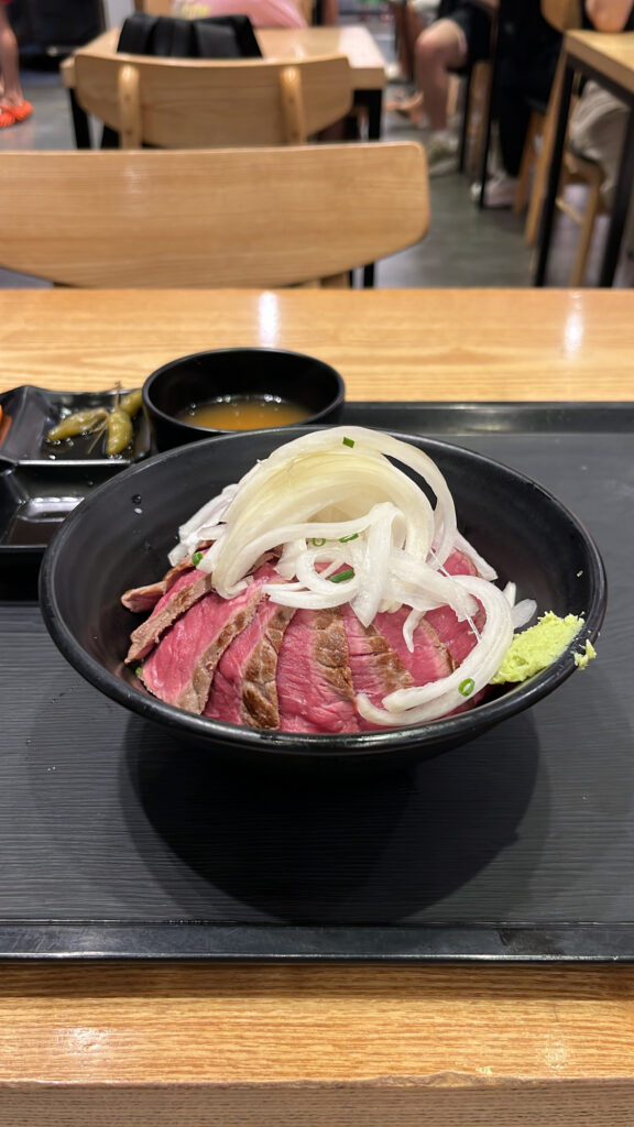 Served steak donburi meal set on a tray at Hongdae Gaemi