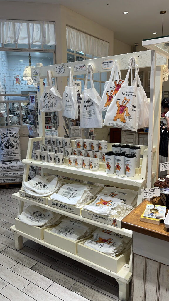 Merchandising display shelf selling branded goods at Cafe Layered