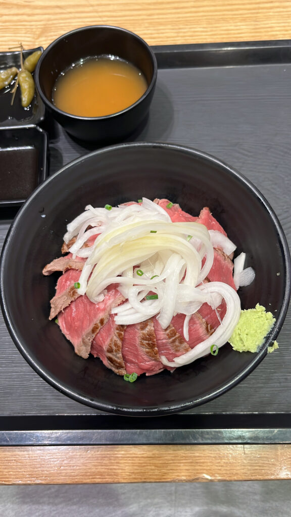 Top view of steak donburi served with miso soup at Hongdae Gaemi