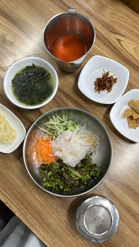 Icy cold raw fish soup broth served separately at Dongchon Mulhoe Busan