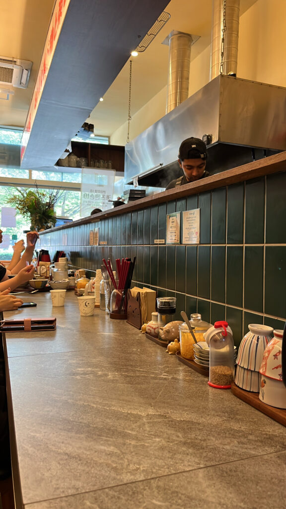 Open kitchen counter table area inside Katsu Mansion 10 Busan