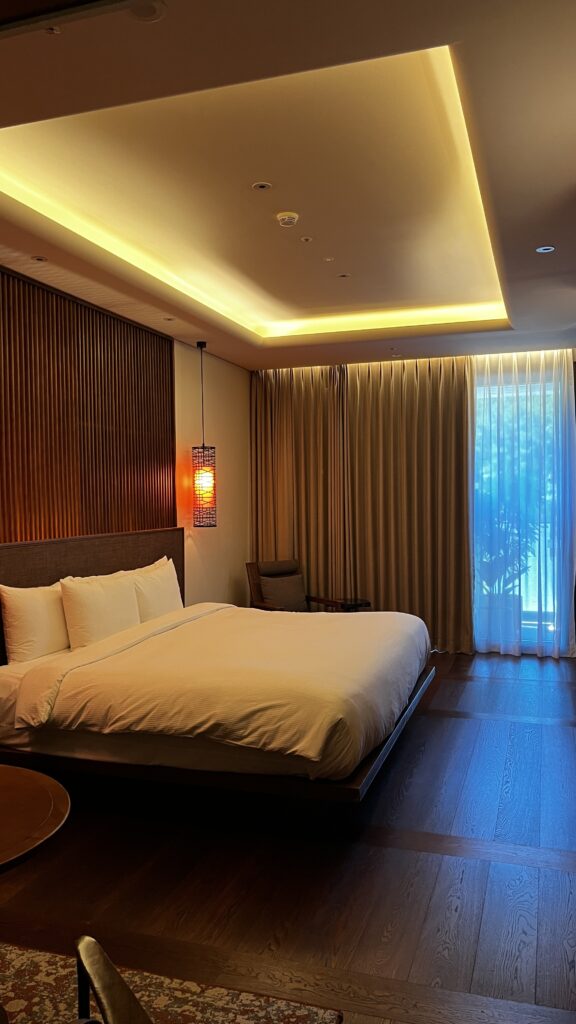 Spacious 70-square-meter deluxe bedroom featuring a serene forest view