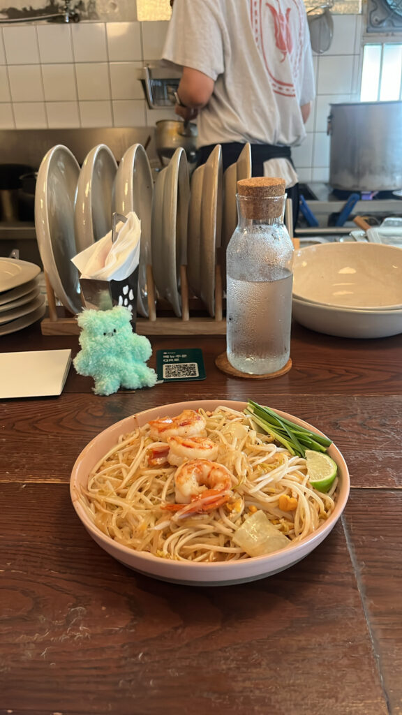 Freshly served shrimp pad thai dish on the dining table at Pili Pili Busan