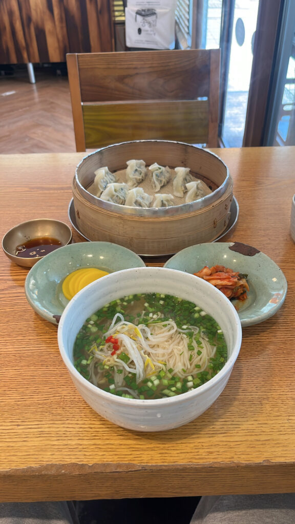 Freshly cooked noodles and handmade dumplings served at Songjeongjib Busan