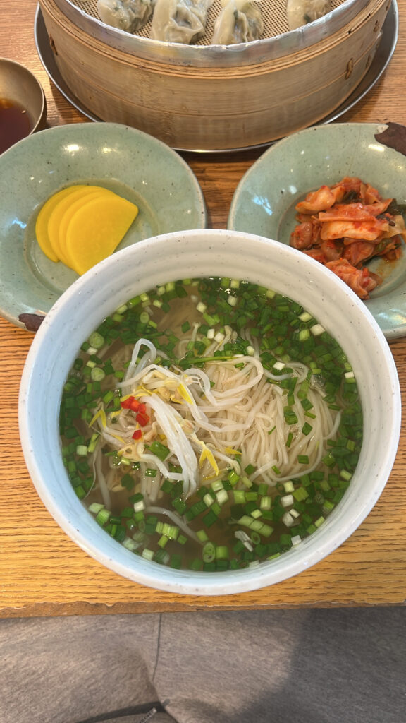Close-up view of warm signature noodle soup at Songjeongjib