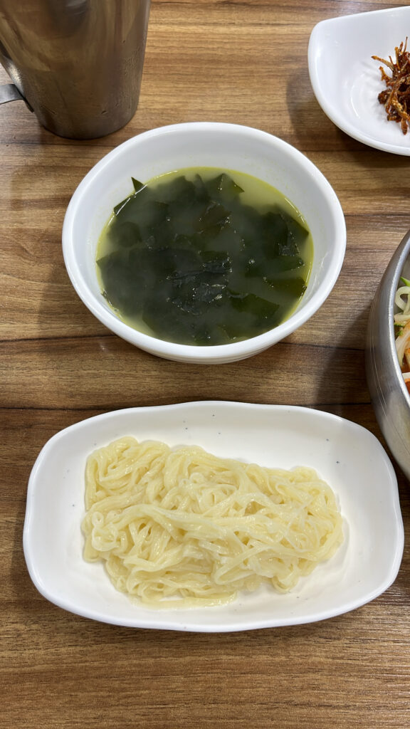 Plain thin noodles served as a side for cold raw fish soup at Dongchon Mulhoe Busan
