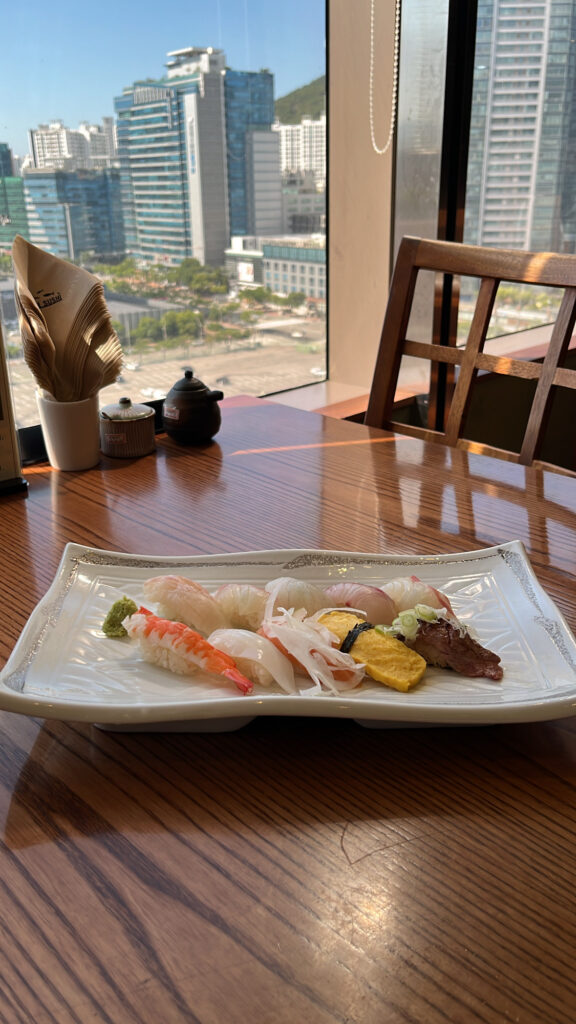 Freshly prepared sushi course served with a city view