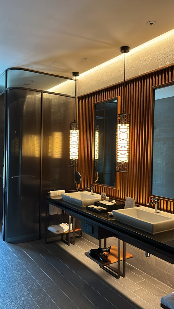Large marble bathroom with double vanities and bathtub at Ananti Cove