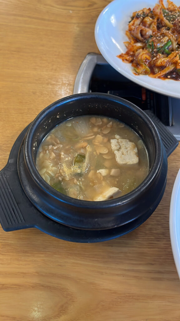 Rich Korean soybean paste stew served with Nakji Bokkeum