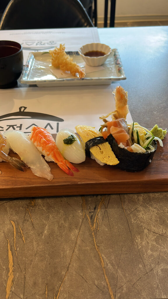 Close-up view of moist, glossy, and remarkably fresh nigiri pieces served at Songjeong Sushi Busan