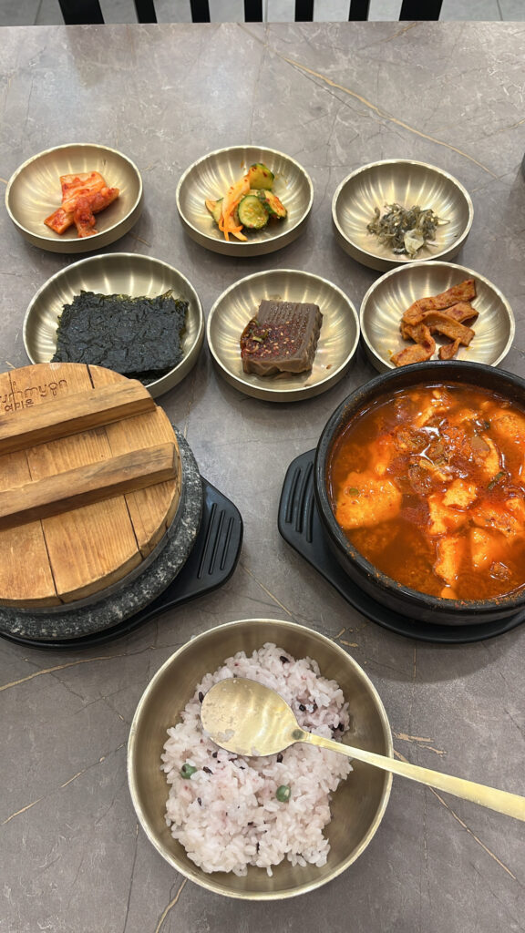 Authentic Korean home-style meal layout at Wandduk Sundubu Busan