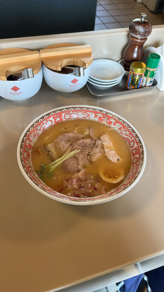 Close-up of rich and creamy Matsudo Miso Ramen topped with chashu and eggs