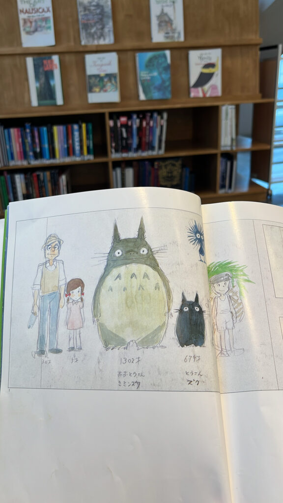 Colorful My Neighbor Totoro illustration pages open on the reading desk