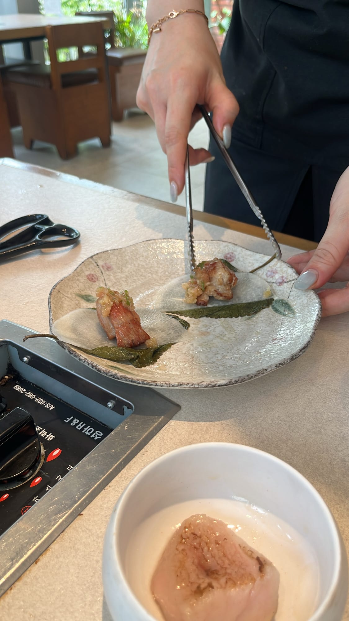 Perfectly grilled pork piece prepared with staff-recommended sauce and side pairing